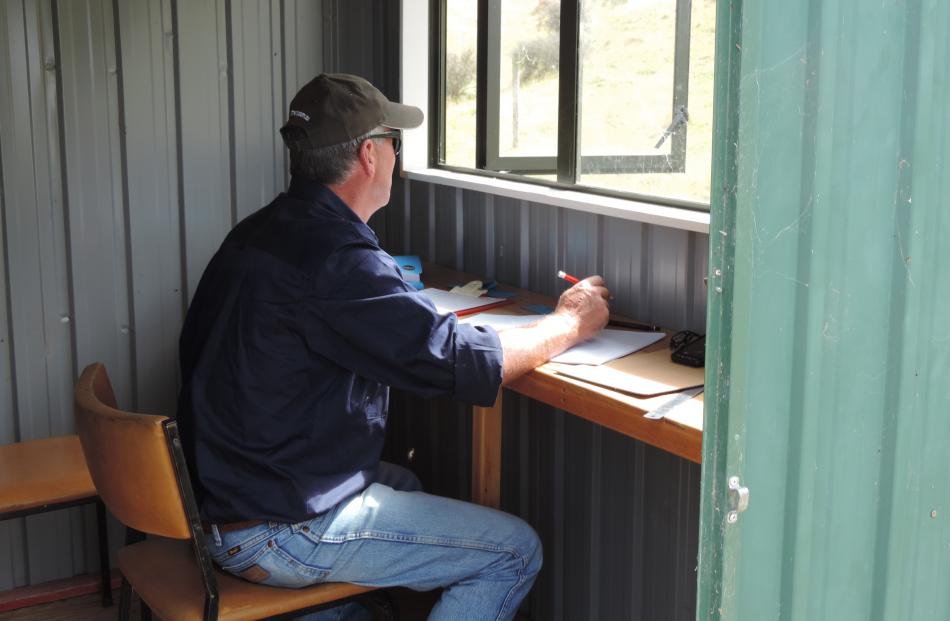 Huntaway judge Ryan Hussey, from the Ashburton Gorge, watches progress on the course.