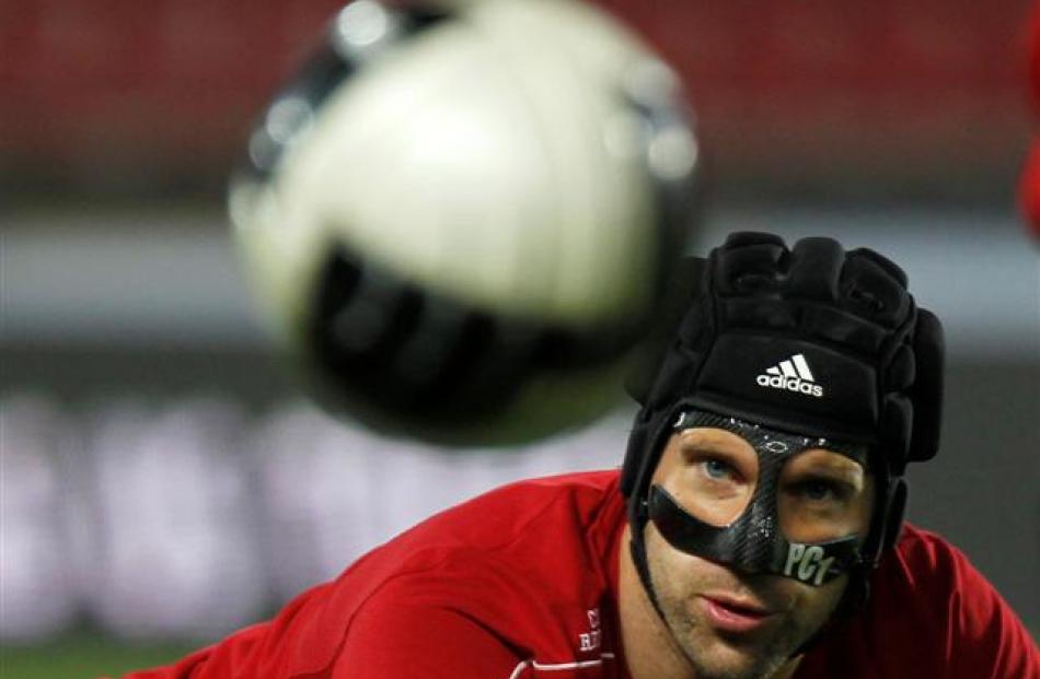 Czech national soccer team player Petr Cech watches a ball during a practice session in Prague....