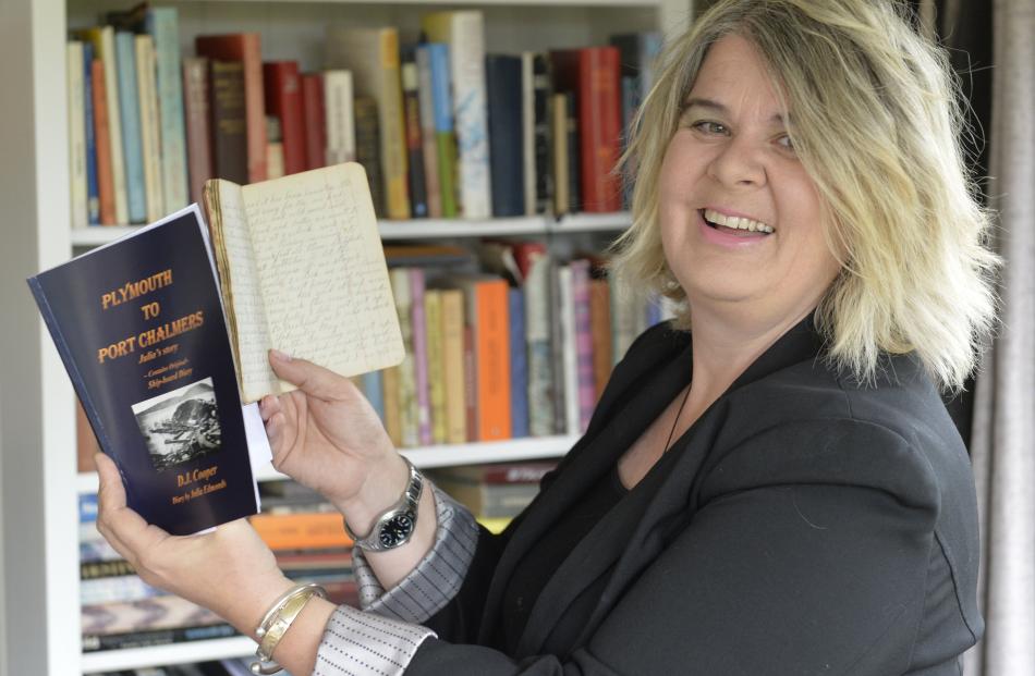 Dunedin teacher and researcher Deirdre Cooper holds a 19th-century diary and her recent book,...