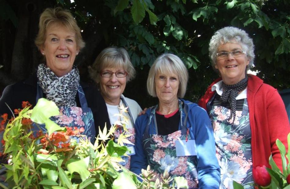 Behind the blooms were (from left) Aderianne Campbell, Marg Bulman, Wendy Paterson and Margaret...