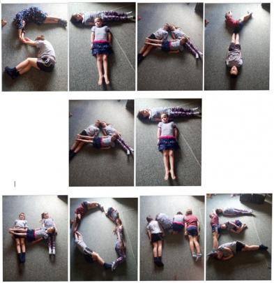 George (10), Henry (8), Rebecca (7) and Maggie (6) spell out an important message at home on...