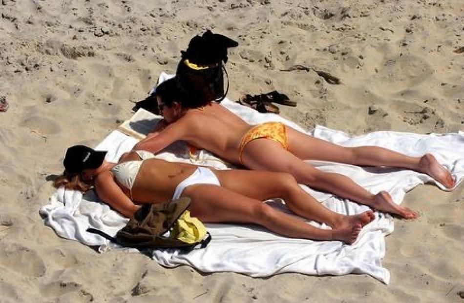 Students Sarah Davidson and Katy Flyger are pleased the university year is over as they sunbathe...