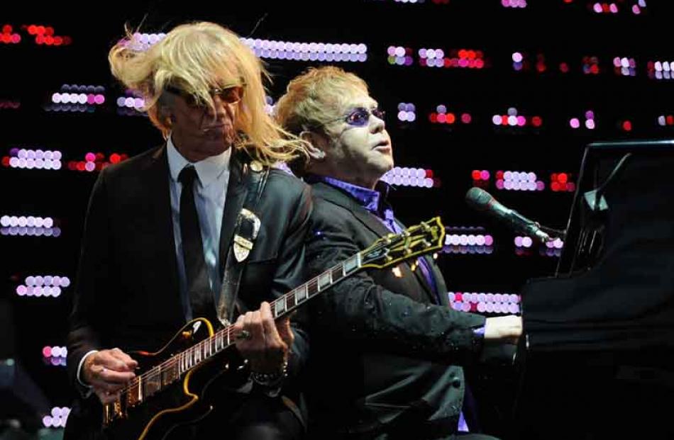 Guitarist Davey Johnstone and Sir Elton rock it out last night.