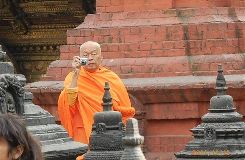 A 'tourist monk' in Kathmandu.