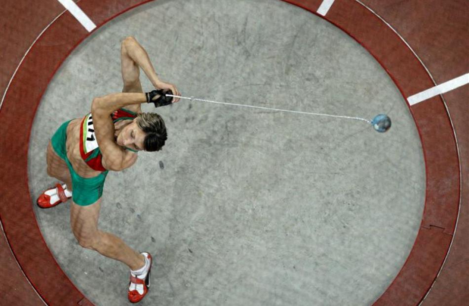 Belarus' gold medal winner Aksana Miankova makes an attempt in the women's hammer final. (AP...