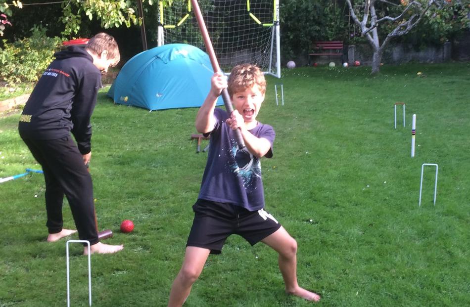 Cormac (8) and Danny (13) Moore play croquet. PHOTO: KIRSTEN DONALD