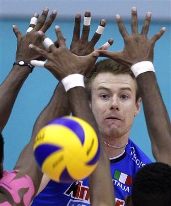 Ivan Zaytsev of Italy spikes the ball against Cuba during the third round of the men's World Cup...