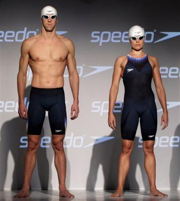 Olympic medalists Michael Phelps, left, and Natalie Coughlin model Speedo's new Fastskin 3...