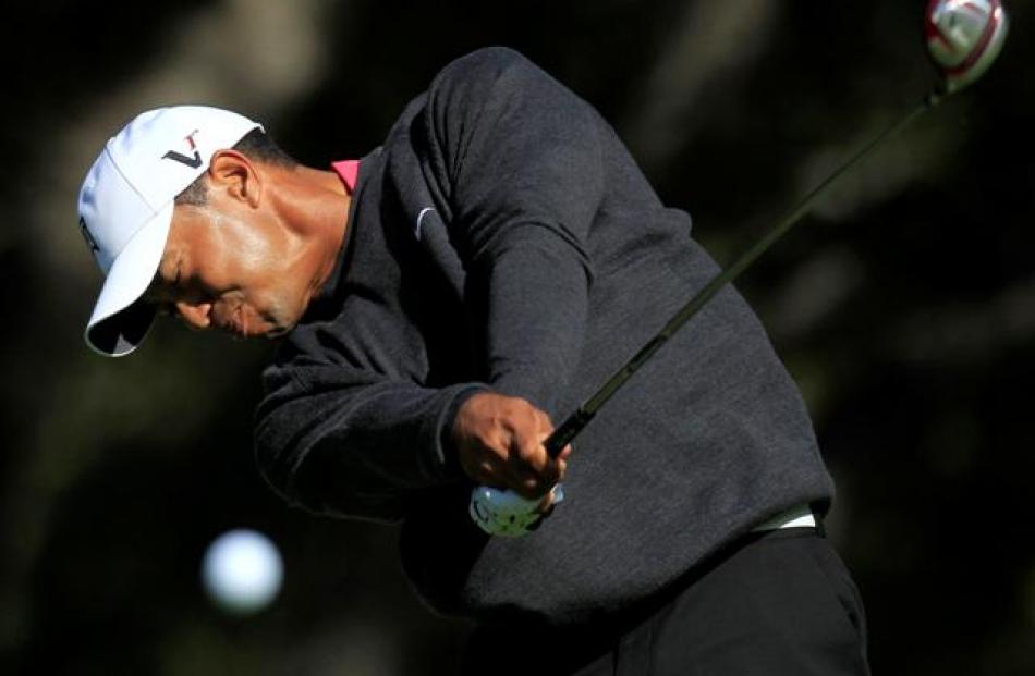 Tiger Woods tees off on the sixth hole during the first round of the Chevron World Challenge PGA...