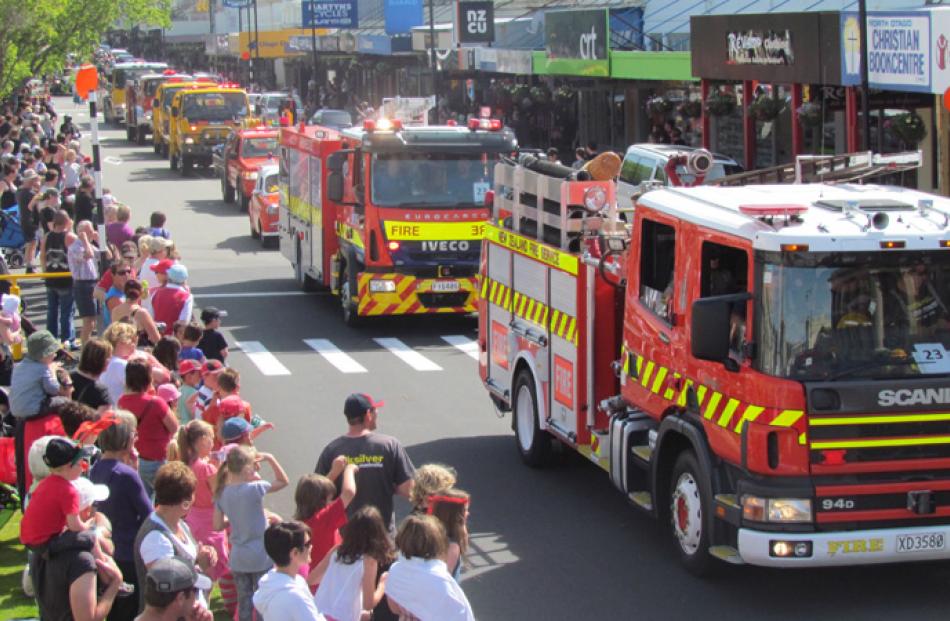 Fire appliances make theie way down Thames St at the Oamaru Santa Parade on Saturday. Photo by...