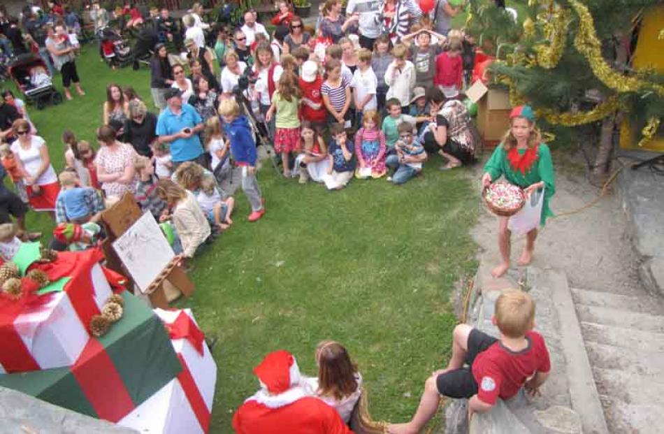 Arrowtown children line up at Butler's Green on Saturday afternon to have their photographs taken...