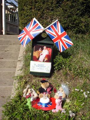 Loyal subjects . . . A Teddy Bears' picnic to honour the Queens 94th birthday today in South Hill...