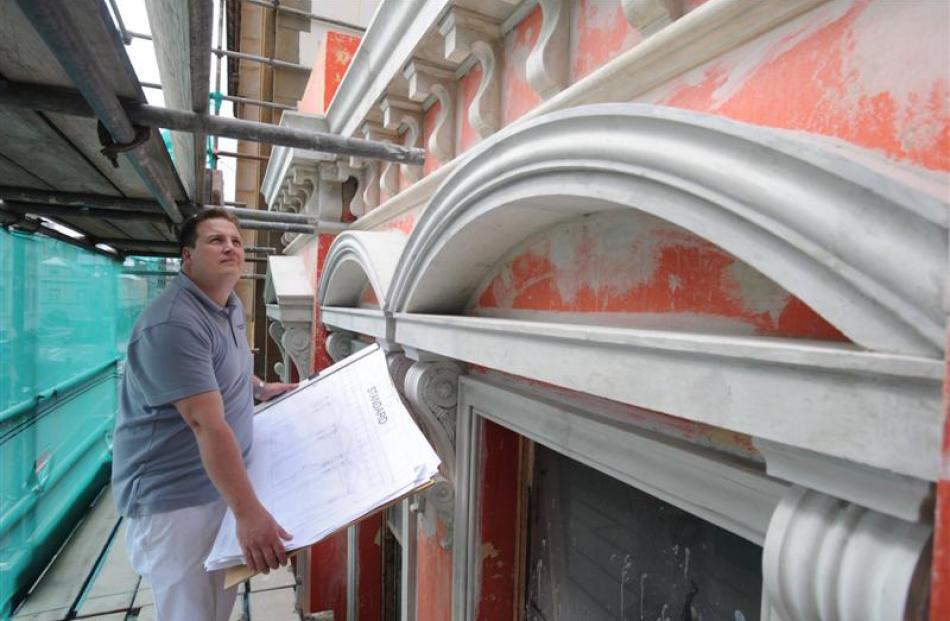 Plasterer Daniel Pollard looks over the plans for the old Standard building in Princes St: "If we...