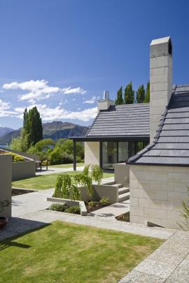 Lake Wanaka house with a variety of outdoor courtyards to capture sun and provide shelter from wind.