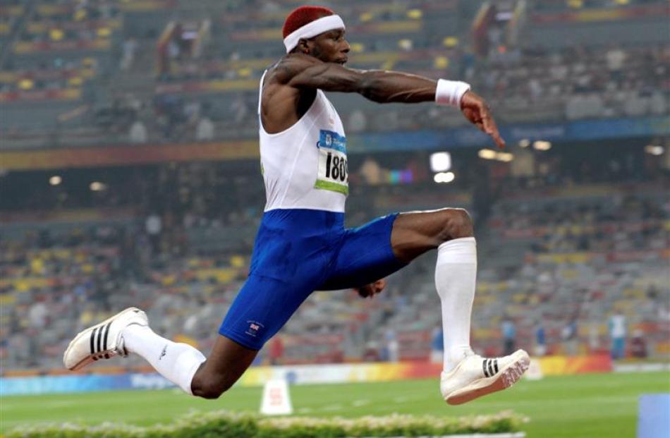 Britain's Phillips Idowu makes an attempt in the final of the men's triple jump.  (AP Photo...