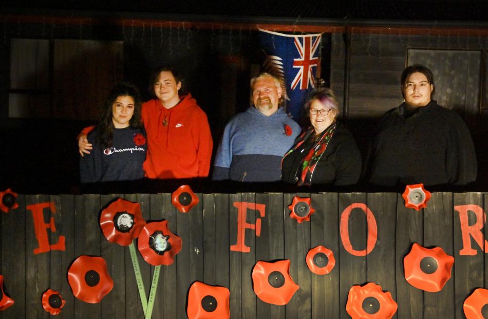 Cayla Hosking, Zachary Nunn, Craig Pollock, Wendy Ross, Kiegan Booth, outside their home at...