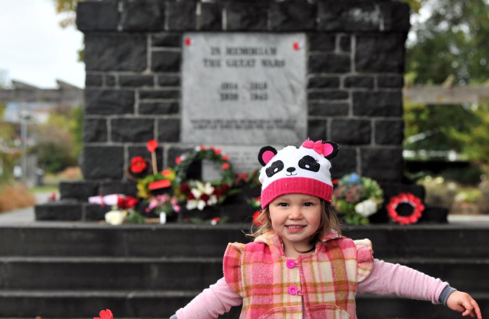 Summer Murray, 2, of Mosgiel,  at the Mosgiel war memorial.