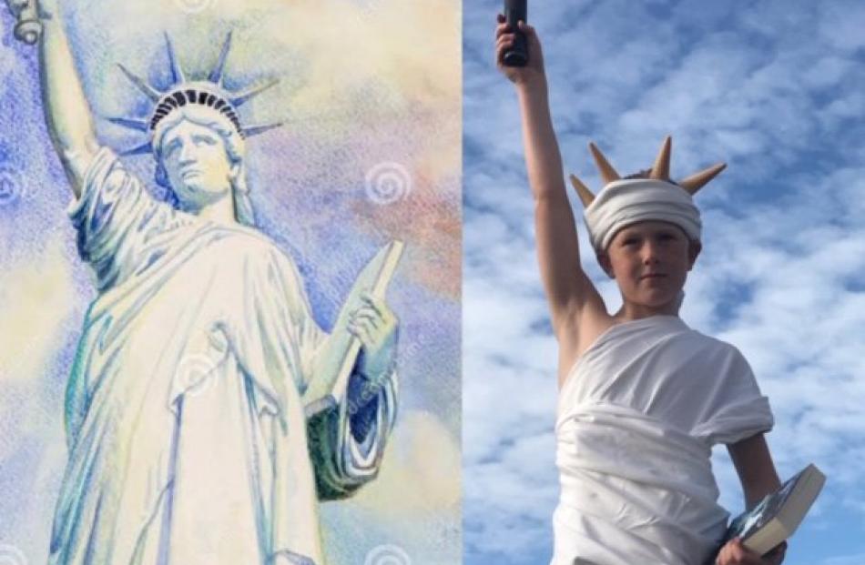 Land of the free . . . Alex Smith (10) at home in Dunedin, recreates the Statue of Liberty for...