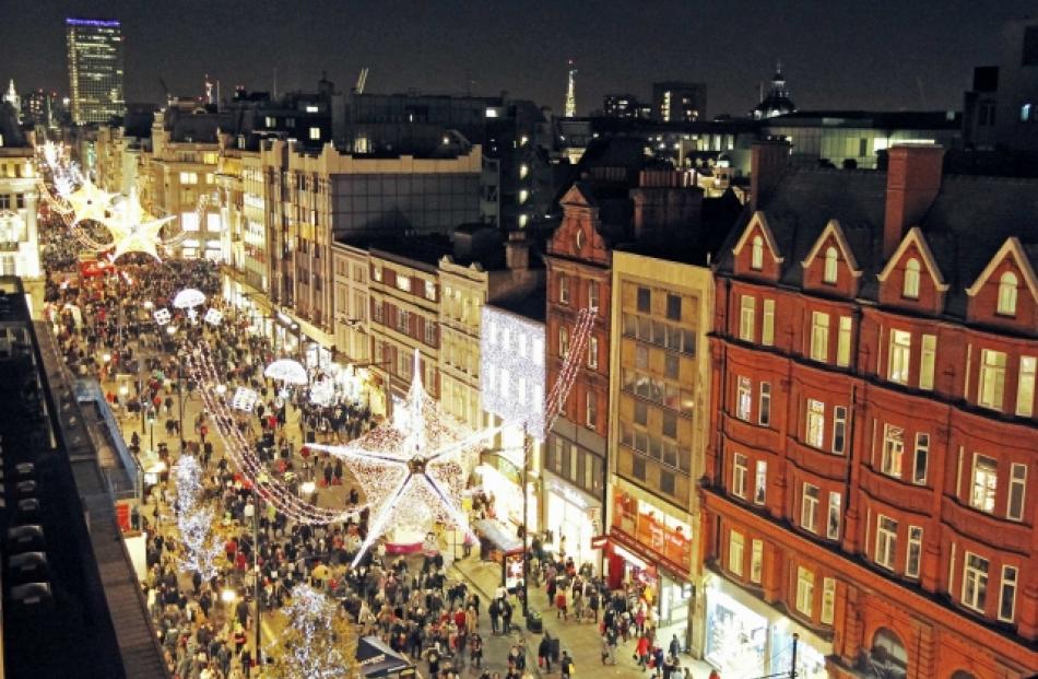 Crowds fill Oxford Street as the famous shopping road is closed to traffic for Christmas shopping...