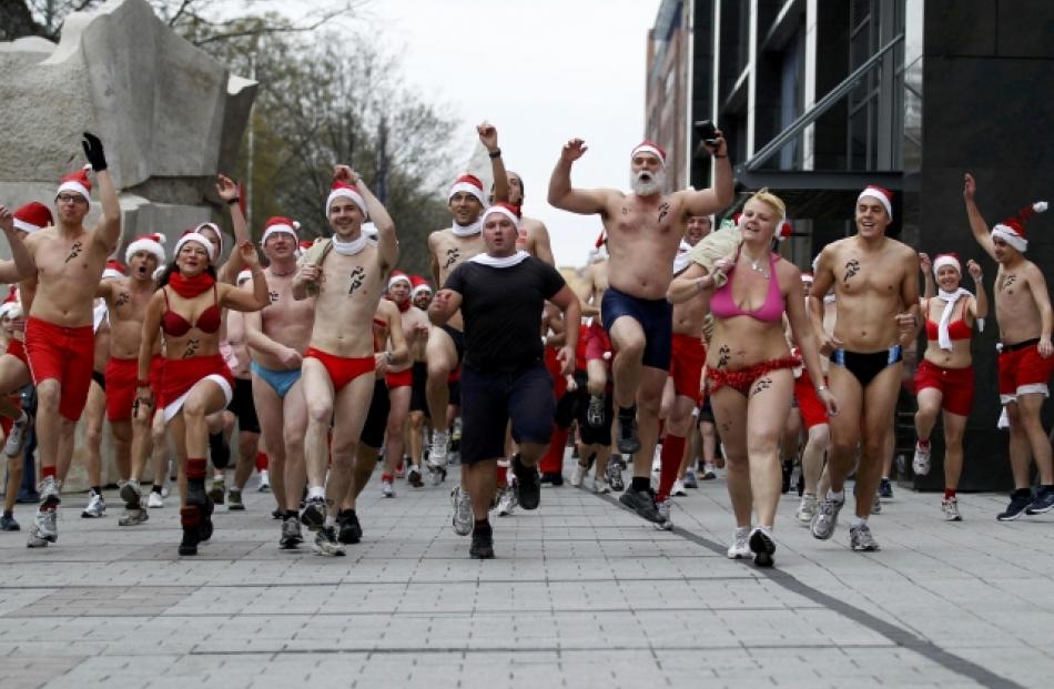 People take part in a half-naked Santa run in Budapest, Hungary. REUTERS/Laszlo Balogh