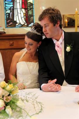 Lisa (nee Davies) and Hayden Cosgrove at their wedding in Queenstown last September.  The couple...