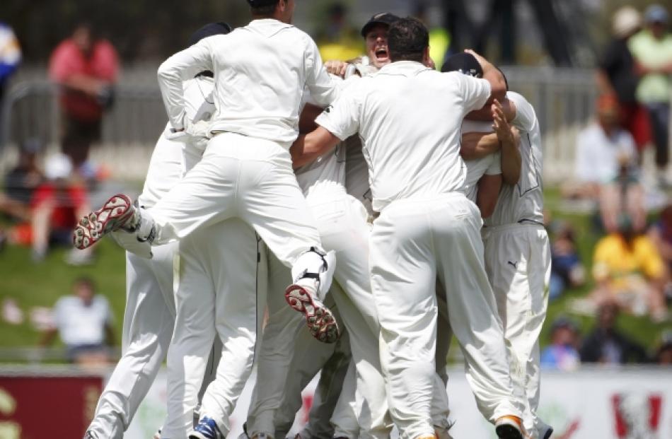 New Zealand players celebrate after beating Australia in the second cricket test at Bellerive...