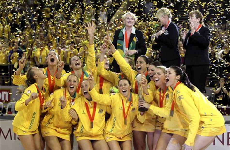 Australian players celebrate after beating New Zealand 58-57 at the World Netball Championships...
