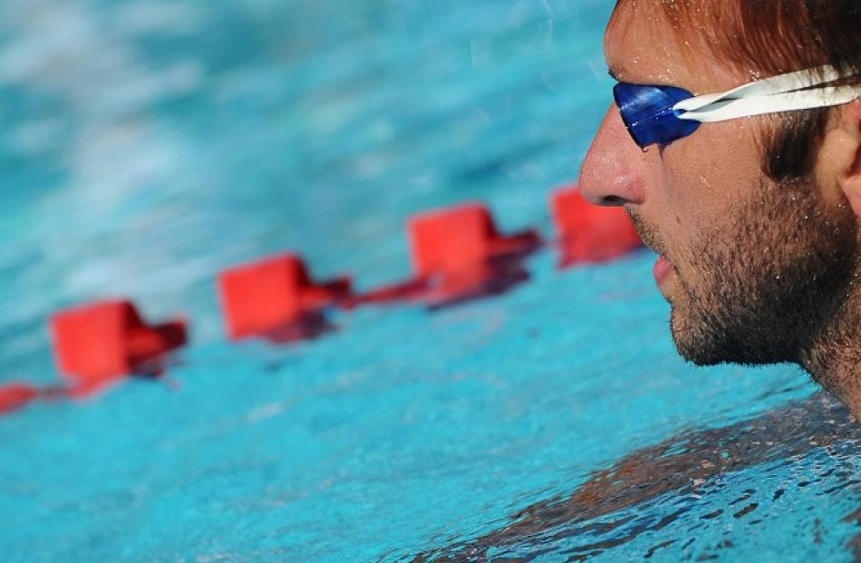 Australian swimmer Ian Thorpe pauses during an open practice session at the national Sports...