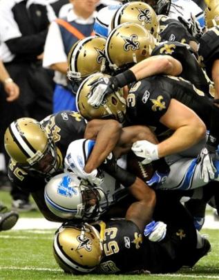 Detroit Lions wide receiver Stefan Logan (11) is stopped by the New Orleans Saints defence during...