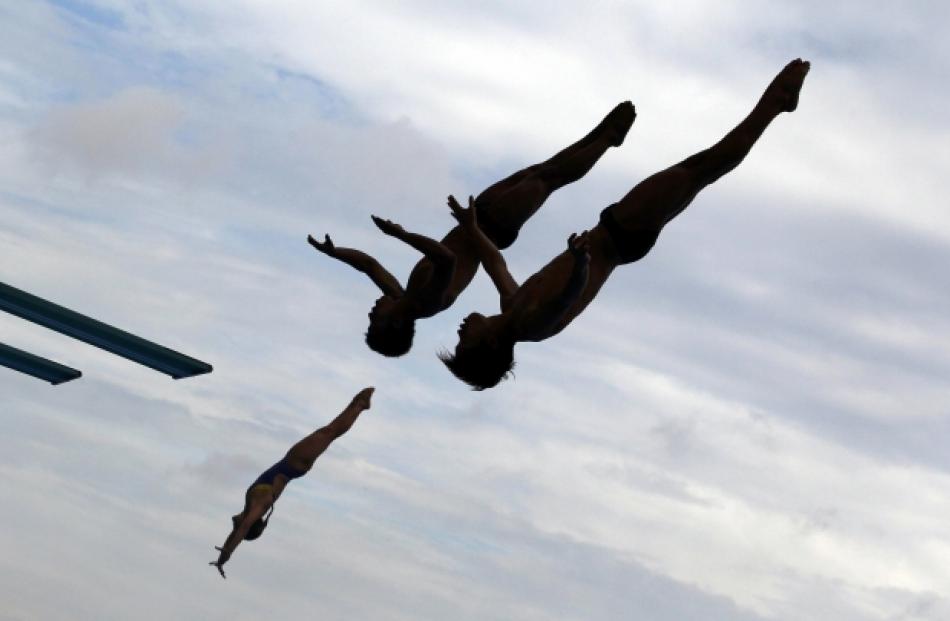 Divers practise before a competition at the 14th FINA World Championships in Shanghai, China....