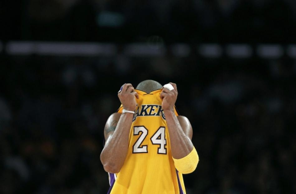 Los Angeles Lakers Kobe Bryant reacts during their NBA basketball loss to the Sacramento Kings in...