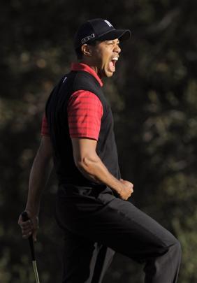 Tiger Woods reacts after winning the Chevron World Challenge golf tournament at Sherwood Country...