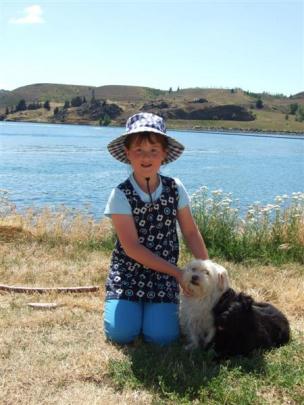 Jodie Kitchingman (8), of Dunedin, with Roxy and Nike, visits her grandparents who are regular...