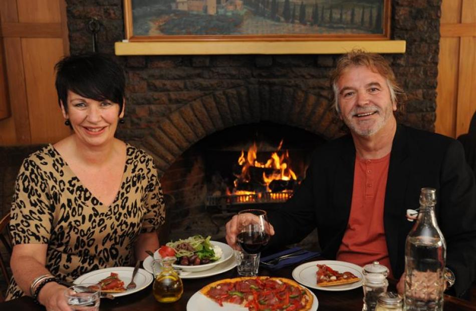 Mine hosts Meegan and Federico (Fred) Gianone share a  meal at their Etrusco restaurant.