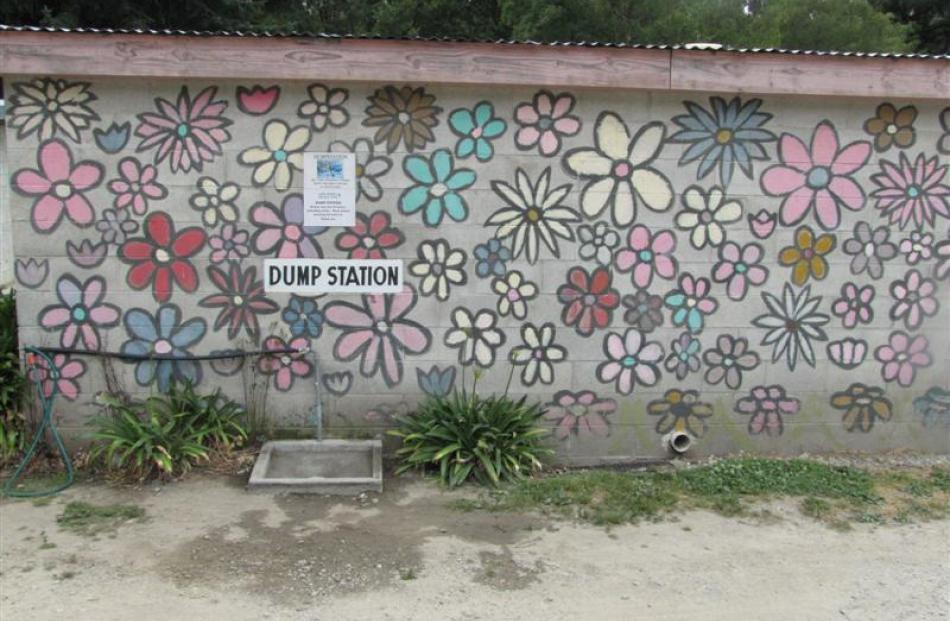 Painted flowers on the back of the dump station and laundry building.