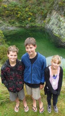 Hamish (11), Alex (14) and Grace Lamb (10), of Timaru, above the deep swimming pool at Danseys...
