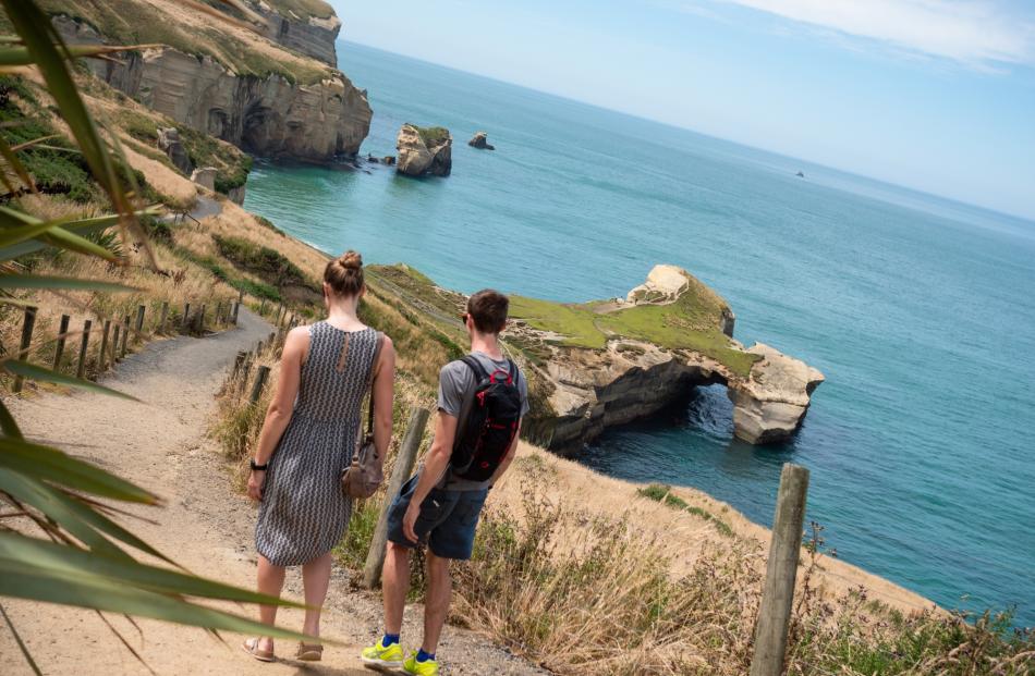 Tunnel Beach, accessed via a short walking track, offers breathtaking scenery.