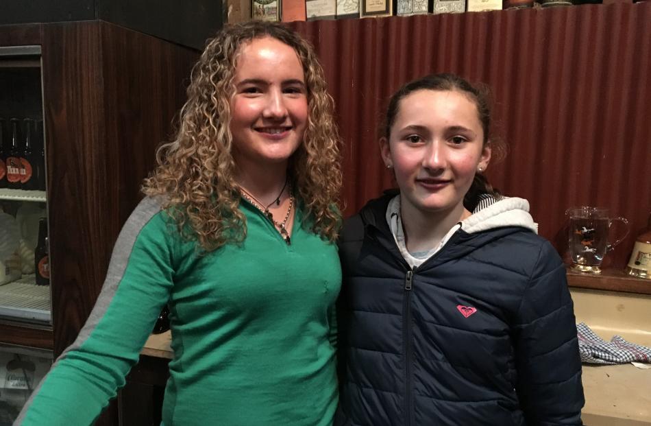 Harriet (15, left) and Georgie (12) Laing  had a day off school to help  their parents at the...