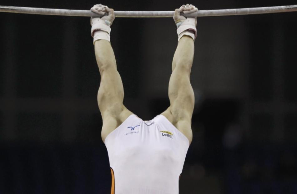 Epke Zonderland of the Netherlands performs on the horizontal bar in the men's artistic...