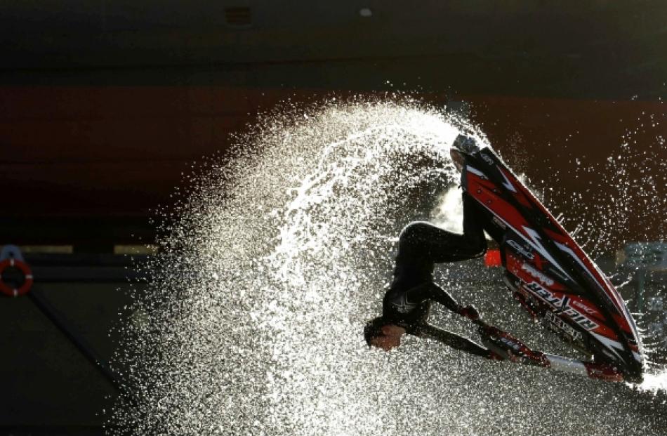 Freestyle jet-ski champion Jack Moule performs at the London Boat Show at the ExCeL centre in...