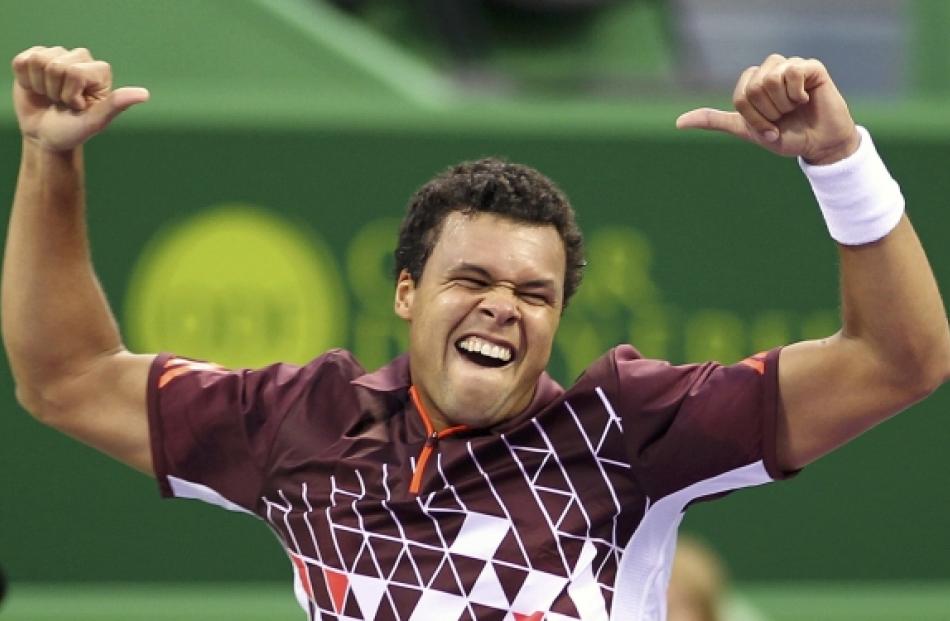 Jo-Wilfried Tsonga of France celebrates after beating Albert Ramos of Spain during the men's...