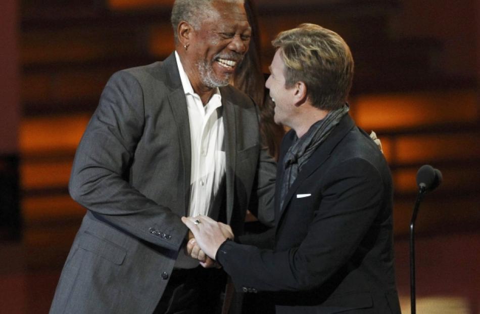 Actor Morgan Freeman (L) accepts the favourite movie icon award from presenter Ewan McGregor at...