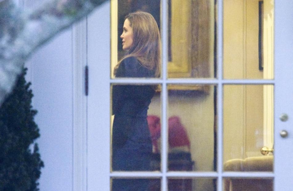 Actress Angelina Jolie is seen in the Oval Office during a meeting with US President Barack Obama...