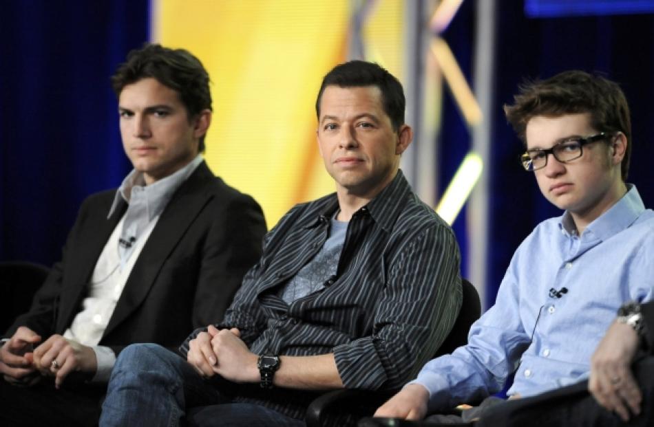 Cast members (from left) Ashton Kutcher, Jon Cryer and Angus T. Jones participate in a panel for ...