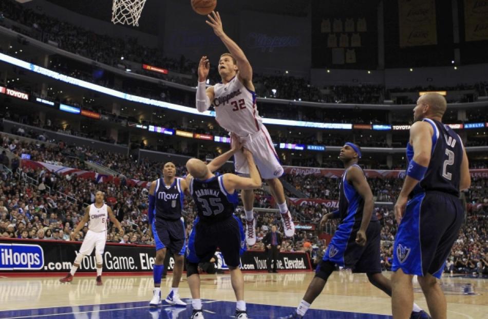 Los Angeles Clippers' Blake Griffin (3rd R) goes up to shoot against the Dallas Mavericks during...