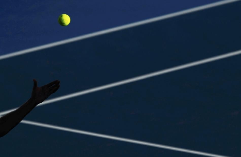 Matthew Ebden of Australia serves to Kei Nishikori of Japan during their men's singles match at...