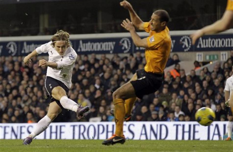 Tottenham Hotspur's Luka Modric, left, shoots to score against Wolverhampton Wanderers during...
