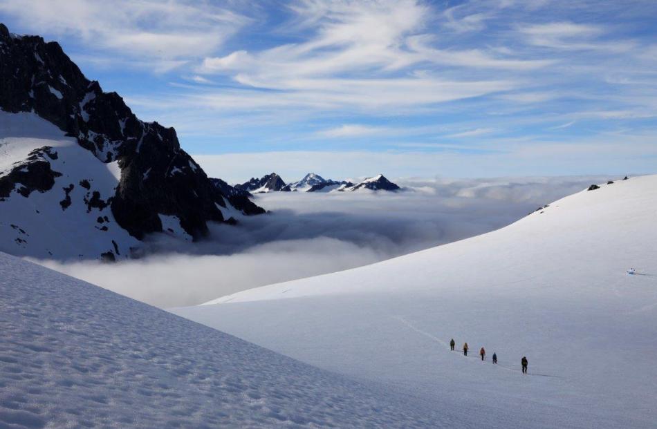 New Zeal owner Paul Nicolson guiding clients to a remote glacier. 