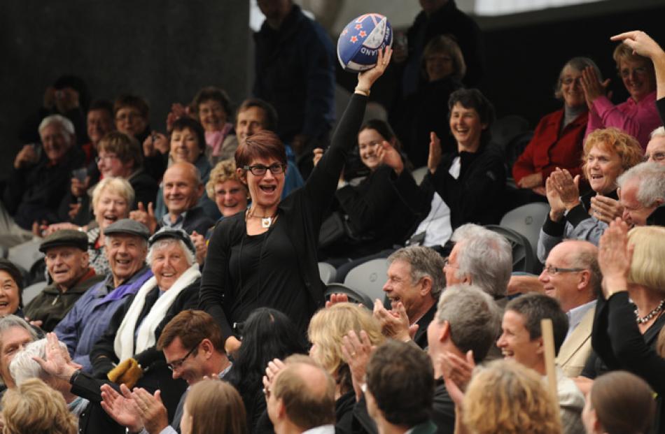 Philippa Baker-Hogan of Wanganui catches a rugby ball kicked into the crowd.