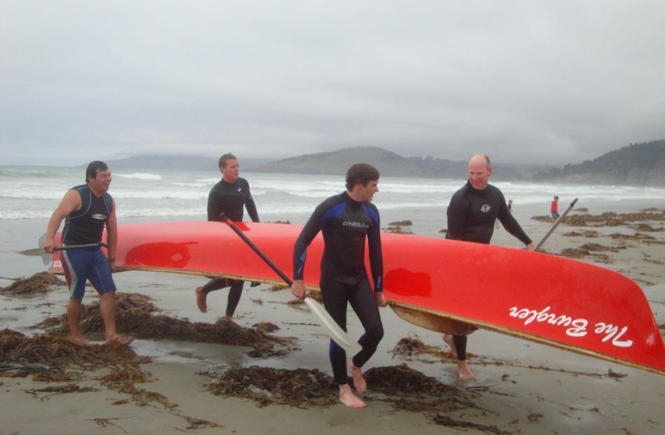 Old boys return with the canoe after a trip down memory lane (from left) Wayne Faasaga, Robert...